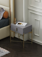 Upholstered Nightstand with Metal Accents